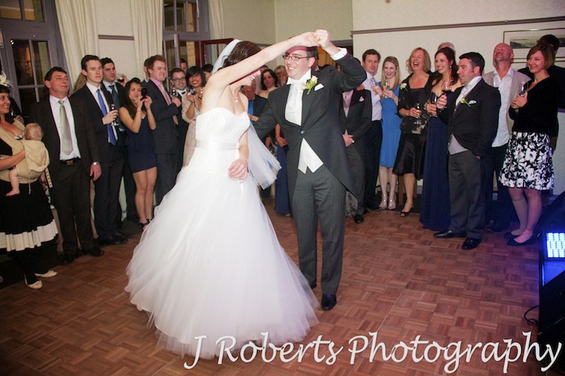 Bride being twirled by the groom during bridal waltz - wedding photography sydney